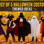 A family of five dressed in various Halloween costumes in a festive setting.